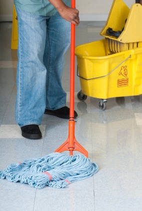 CleanLinc Cleaning Services, Inc janitor in Palmyra, NE mopping floor.